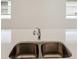 Modern kitchen sink with double basin and chrome faucet at 113 Whiteland Bnd, Nokomis, FL 34275