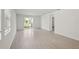 Spacious living area with tile floor and access to backyard at 113 Whiteland Bnd, Nokomis, FL 34275