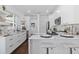 Modern kitchen with white cabinets, marble countertops, and stainless steel appliances at 1101 22Nd N Ave, St Petersburg, FL 33704