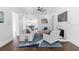 Living room with hardwood floors, fireplace, and ceiling fan at 1101 22Nd N Ave, St Petersburg, FL 33704
