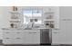Modern kitchen with white cabinets and marble countertops at 1101 22Nd N Ave, St Petersburg, FL 33704