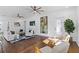 Living room featuring hardwood floors, fireplace, and comfortable seating at 1101 22Nd N Ave, St Petersburg, FL 33704
