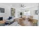 Living room with hardwood floors, ceiling fan, and large windows at 1101 22Nd N Ave, St Petersburg, FL 33704