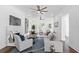 Open living room with hardwood floors, fireplace and ceiling fan at 1101 22Nd N Ave, St Petersburg, FL 33704