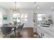 Modern dining room with wood table and gray chairs at 1101 22Nd N Ave, St Petersburg, FL 33704