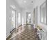 Sunlit hallway with terracotta tile floors and access to exterior at 1101 22Nd N Ave, St Petersburg, FL 33704