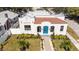 Spanish style home with a terracotta roof and blue door at 1101 22Nd N Ave, St Petersburg, FL 33704