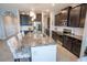 Spacious kitchen featuring granite countertops, stainless appliances, and dark wood cabinetry at 8493 Hardy Bay Loop, Wesley Chapel, FL 33545