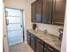 Walk-in pantry with granite countertop and ample storage at 8493 Hardy Bay Loop, Wesley Chapel, FL 33545