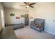 bedroom with twin bed, crib, and built-in desk at 8493 Hardy Bay Loop, Wesley Chapel, FL 33545