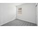 Simple bedroom with grey carpet and window at 116 Whiteland Bnd, Nokomis, FL 34275