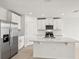 Modern kitchen with stainless steel appliances and white cabinetry at 164 Lazy Shore Dr, Nokomis, FL 34275