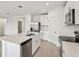 Spacious kitchen with island, stainless steel appliances, and white cabinets at 164 Lazy Shore Dr, Nokomis, FL 34275