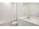 Clean bathroom with a shower/tub combo, white vanity, and mirror at 164 Lazy Shore Dr, Nokomis, FL 34275
