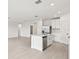 Open kitchen featuring a large island and stainless steel appliances at 164 Lazy Shore Dr, Nokomis, FL 34275