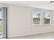 Spacious living room with tile floors and large windows at 164 Lazy Shore Dr, Nokomis, FL 34275