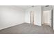 Bright bedroom with gray carpet and access to bathroom and closet at 164 Lazy Shore Dr, Nokomis, FL 34275
