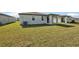 Spacious backyard with grassy area and a home at 188 Lazy Shore Dr, Nokomis, FL 34275