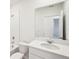 Bathroom with single vanity, bathtub, toilet and large mirror at 188 Lazy Shore Dr, Nokomis, FL 34275