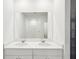 Double vanity bathroom with a large mirror and a shower at 188 Lazy Shore Dr, Nokomis, FL 34275