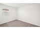 Charming bedroom with a window, neutral walls, and carpeted floors at 188 Lazy Shore Dr, Nokomis, FL 34275