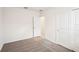 Well-lit bedroom with neutral walls and carpet, offering closet space at 188 Lazy Shore Dr, Nokomis, FL 34275