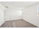Spacious bedroom with carpet flooring and two windows, offering ample natural light at 188 Lazy Shore Dr, Nokomis, FL 34275