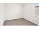 Small bedroom with grey carpet, one window, and neutral walls at 188 Lazy Shore Dr, Nokomis, FL 34275