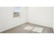Bright bedroom with neutral carpeting and a window at 188 Lazy Shore Dr, Nokomis, FL 34275