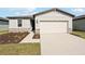 Single-story house with light-grey exterior and attached garage at 188 Lazy Shore Dr, Nokomis, FL 34275