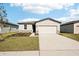 One-story home with attached garage and landscaped lawn at 188 Lazy Shore Dr, Nokomis, FL 34275