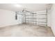 Attached garage with concrete flooring and an automatic door at 188 Lazy Shore Dr, Nokomis, FL 34275