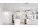 Modern kitchen featuring white cabinets and stainless steel appliances at 188 Lazy Shore Dr, Nokomis, FL 34275
