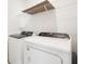 Laundry room with Whirlpool washer and dryer at 188 Lazy Shore Dr, Nokomis, FL 34275