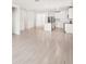 Open living space with modern tile flooring and kitchen access at 188 Lazy Shore Dr, Nokomis, FL 34275