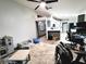 Open living space with a play area, office space, and tile floors at 7940 Fashion Loop, New Port Richey, FL 34654