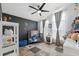 Adorable bedroom with a space theme, gray crib, and plenty of storage at 7940 Fashion Loop, New Port Richey, FL 34654