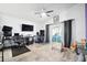 Gathering room with two workspaces, a play area, and access to a patio at 7940 Fashion Loop, New Port Richey, FL 34654