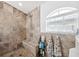 Updated bathroom with walk-in shower, tile surround, and built-in bench at 7940 Fashion Loop, New Port Richey, FL 34654