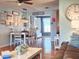 Dining area with hardwood floors and white table, adjacent to the kitchen at 751 Nantucket Rd, Venice, FL 34293