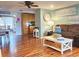 Bright living room with hardwood floors, brown sectional sofa, and a coffee table at 751 Nantucket Rd, Venice, FL 34293