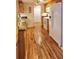Modern kitchen featuring granite countertops, wood flooring, and stainless steel appliances at 751 Nantucket Rd, Venice, FL 34293