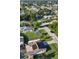 Aerial view of a neighborhood, featuring a house with solar panels at 751 Nantucket Rd, Venice, FL 34293