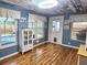 Bright sunroom with pool access and wood-look flooring at 751 Nantucket Rd, Venice, FL 34293