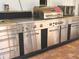 Stainless steel outdoor kitchen with grill, cooktop and oven at 751 Nantucket Rd, Venice, FL 34293