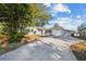 Single story home with a large tree in the front yard at 11357 116Th Ave, Largo, FL 33778
