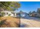 Ranch style home with attached garage and mature landscaping at 11357 116Th Ave, Largo, FL 33778