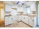 White kitchen with wood countertops needs some finishing work at 11357 116Th Ave, Largo, FL 33778