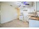 Partially updated kitchen with white cabinetry and butcher block counters at 11357 116Th Ave, Largo, FL 33778