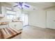 Spacious kitchen with white cabinets, wood countertops, and sliding glass door at 11357 116Th Ave, Largo, FL 33778